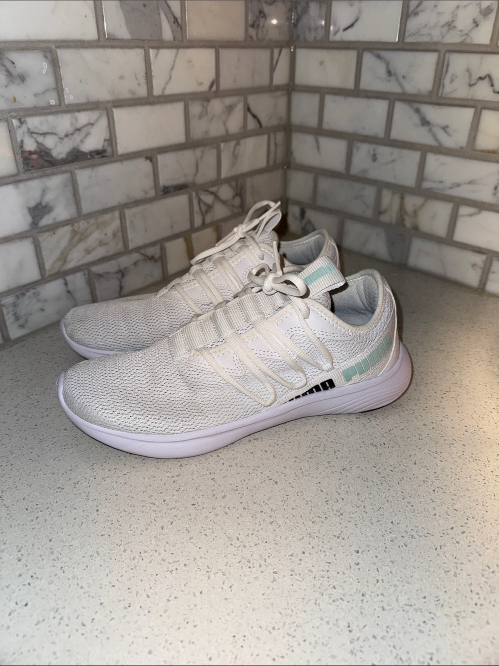 Lightweight women’s PUMA White Knit Sneakers with Mint Accent